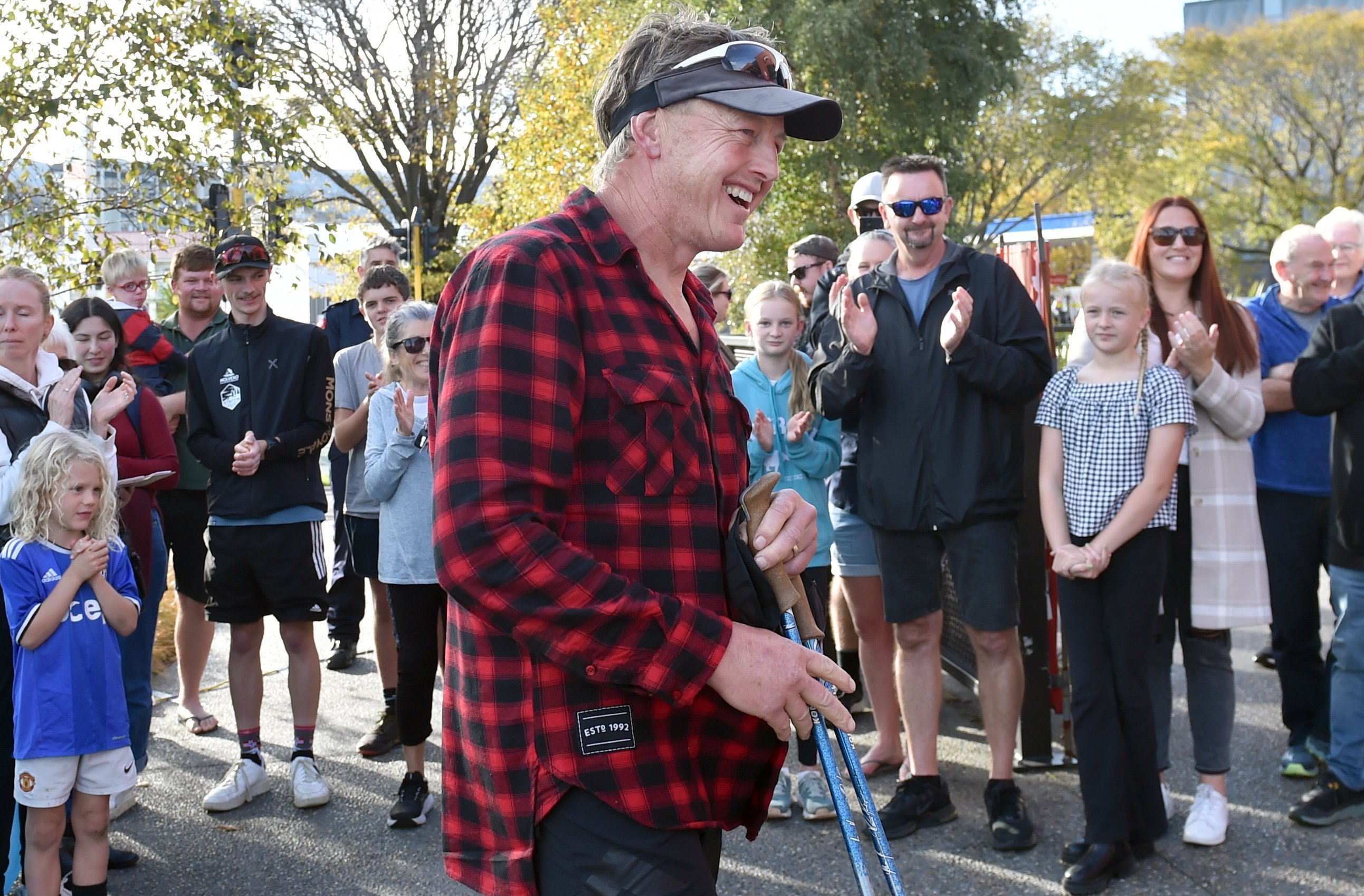 Dunedin ultra-marathon runner Glenn Sutton is greeted by supporters as he arrives at Emerson’s...