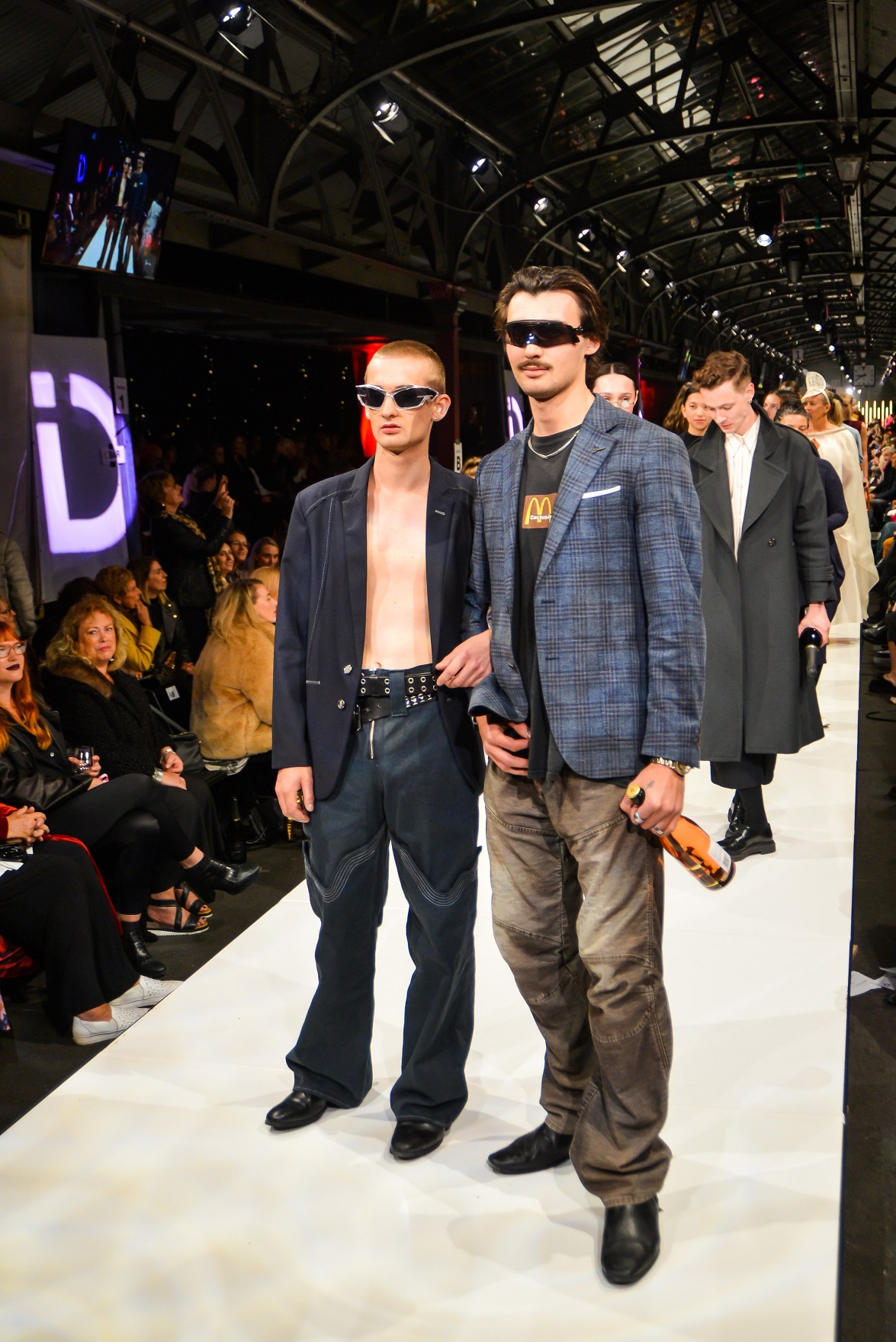 Jonty Blakely (right) and models wearing designs on the catwalk at iD last year. Photo: Chris...