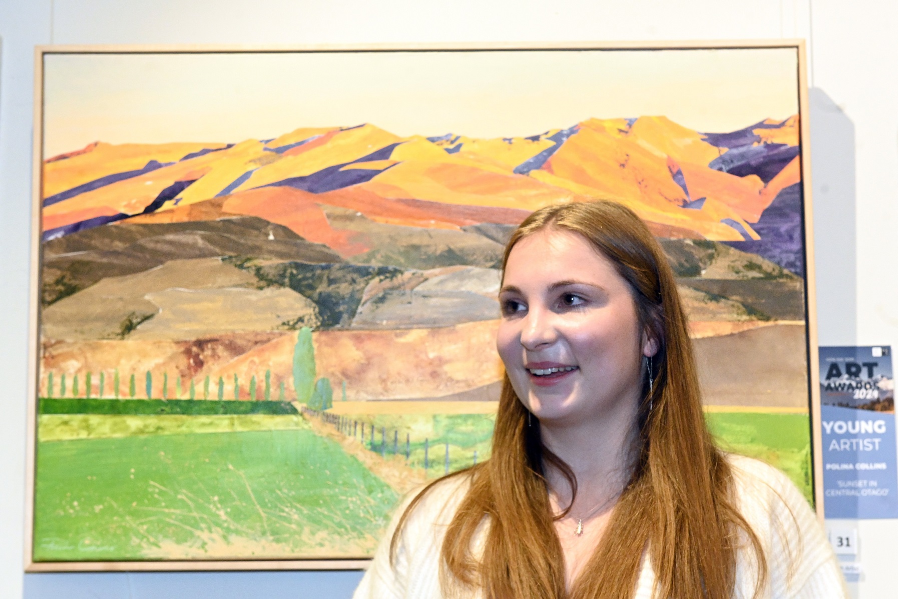 University of Otago student Polina Collins stands in front of her winning entry Sunset in Central...