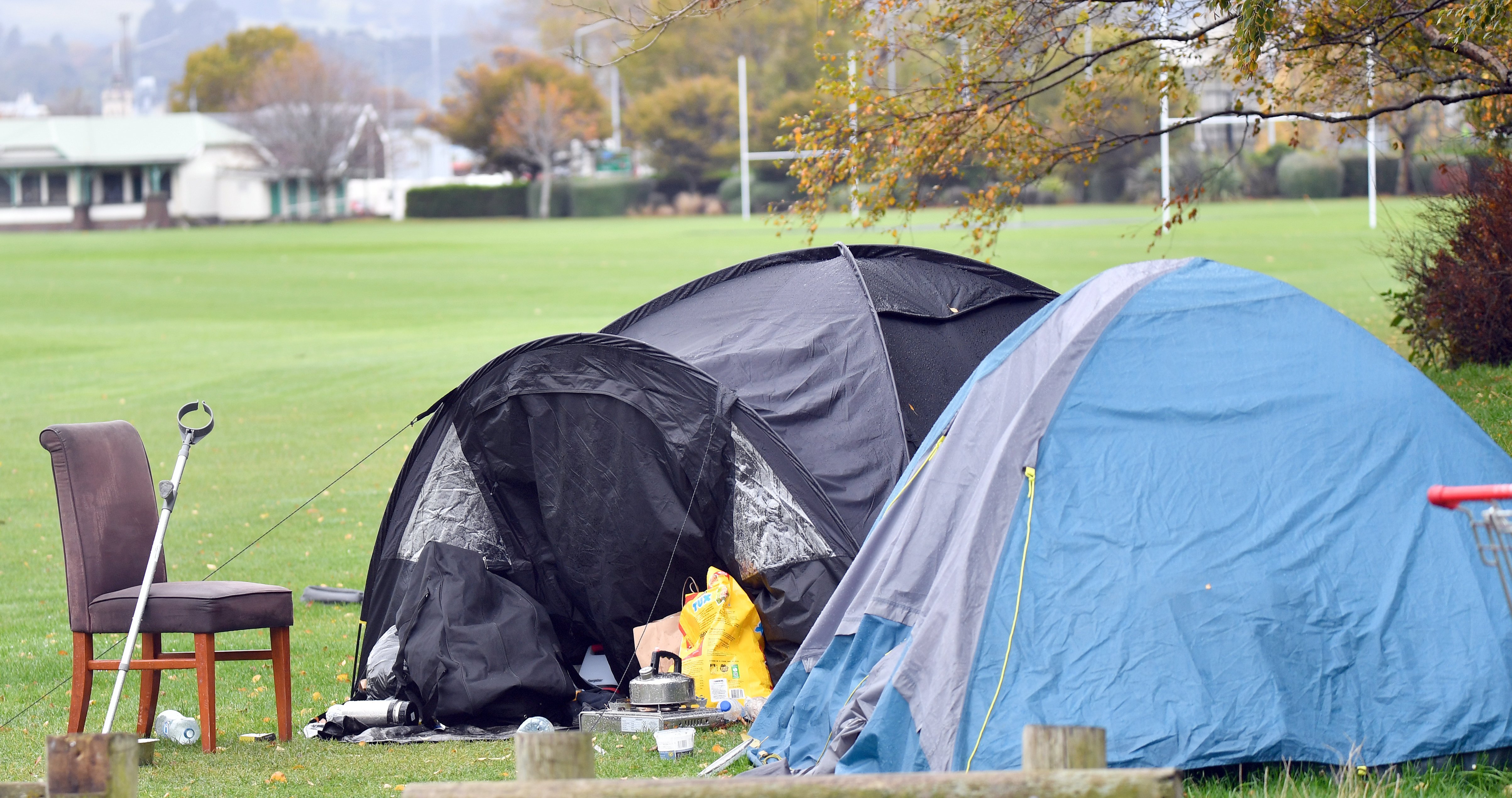 A homeless woman in a tent at the Oval walks with a crutch, yet has been waiting for a state home...