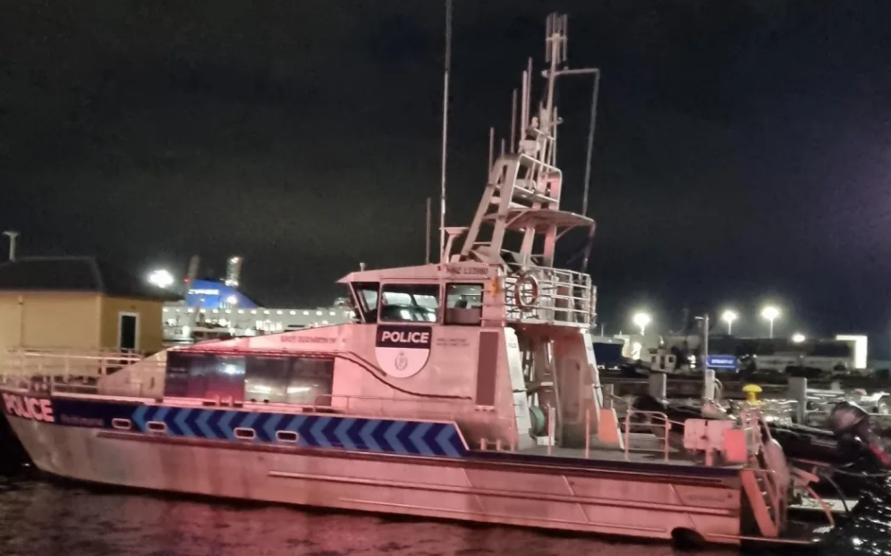 The Wellington police boat moored at Wellington Harbour after spending the day searching for a...