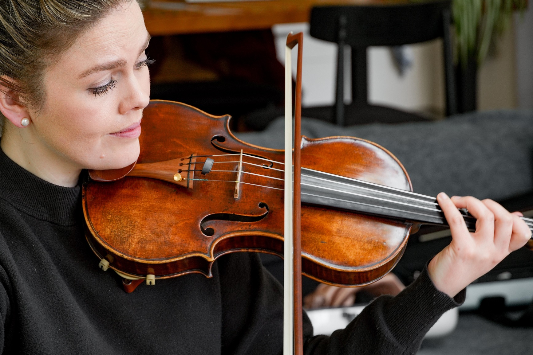 Oddie in rehearsal with the Italian violin, crafted by Giovanni Francesco Pressenda in 1834, that...
