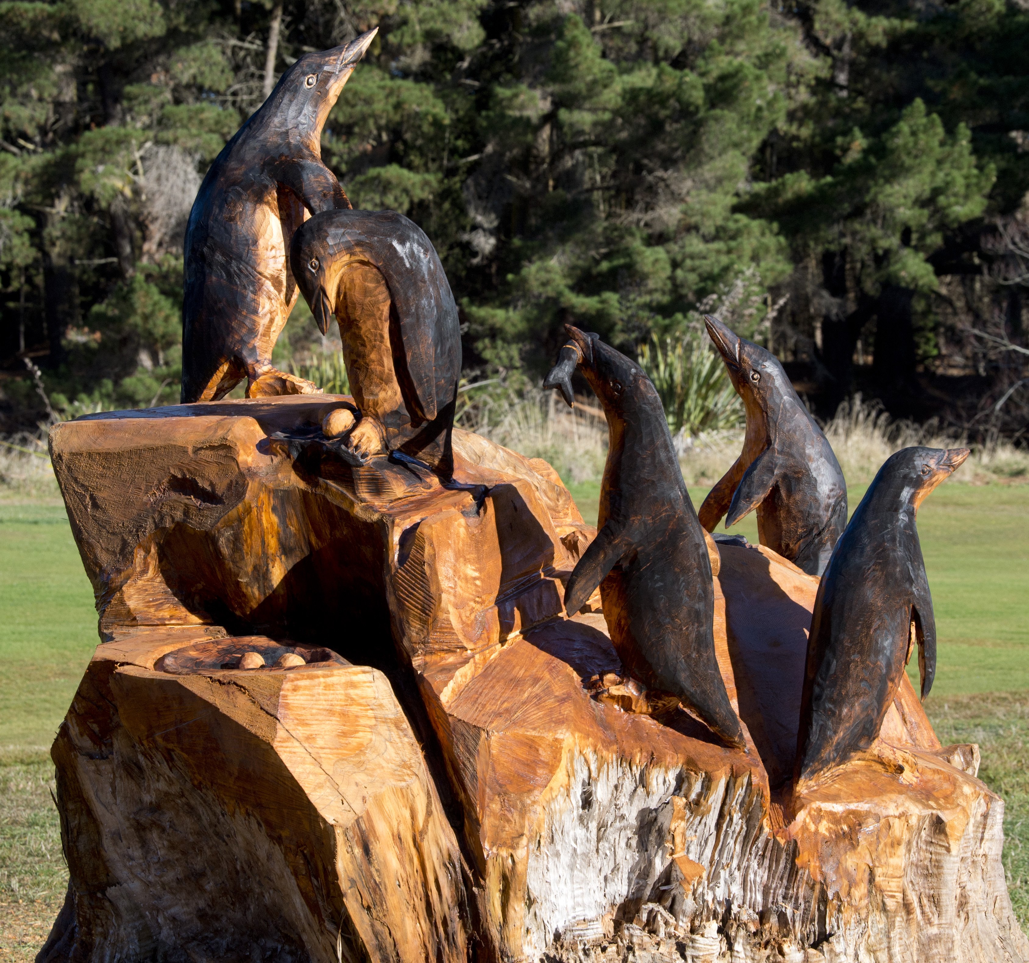Two tree stumps on the course have been transformed by Mr Stadler and now feature penguins,...