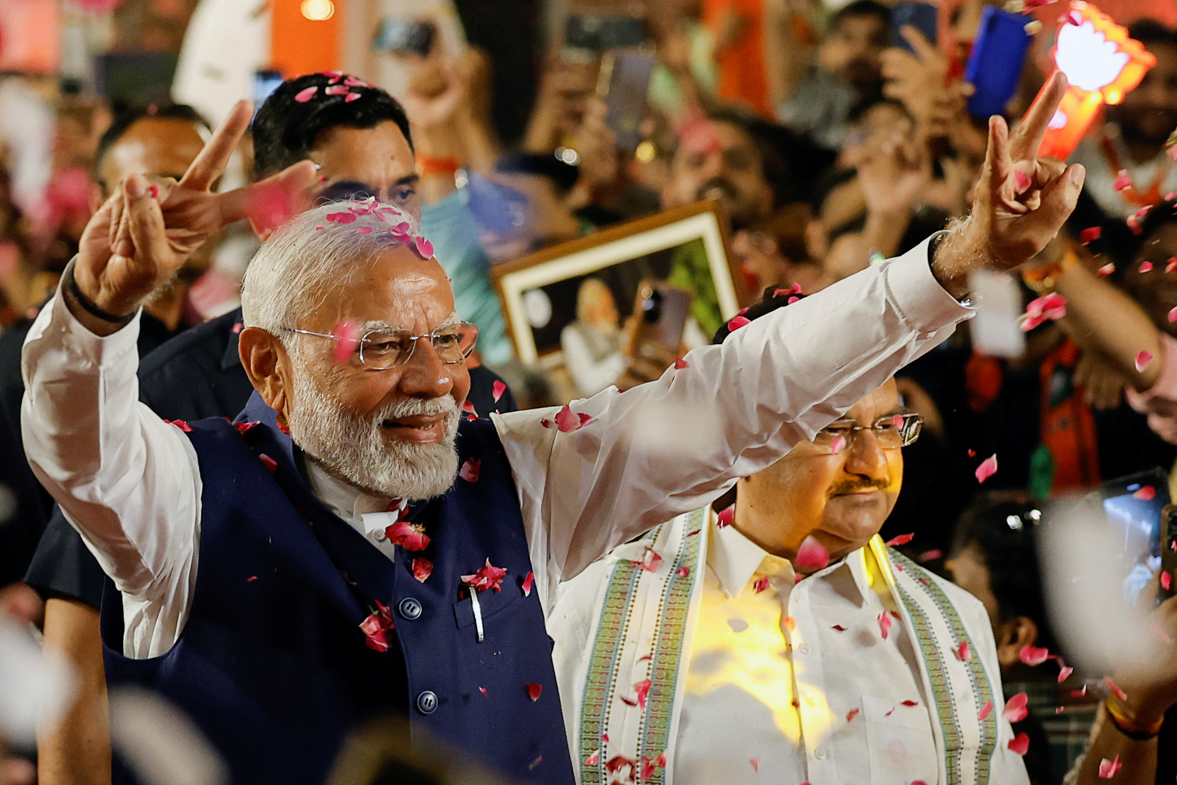 Indian Prime Minister Narendra Modi gestures as he arrives at Bharatiya Janata Party (BJP)...