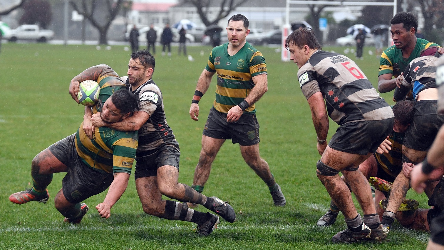Southern halfback Wilson Driver collars Green Island prop Alafala Tailega at Bathgate Park on...