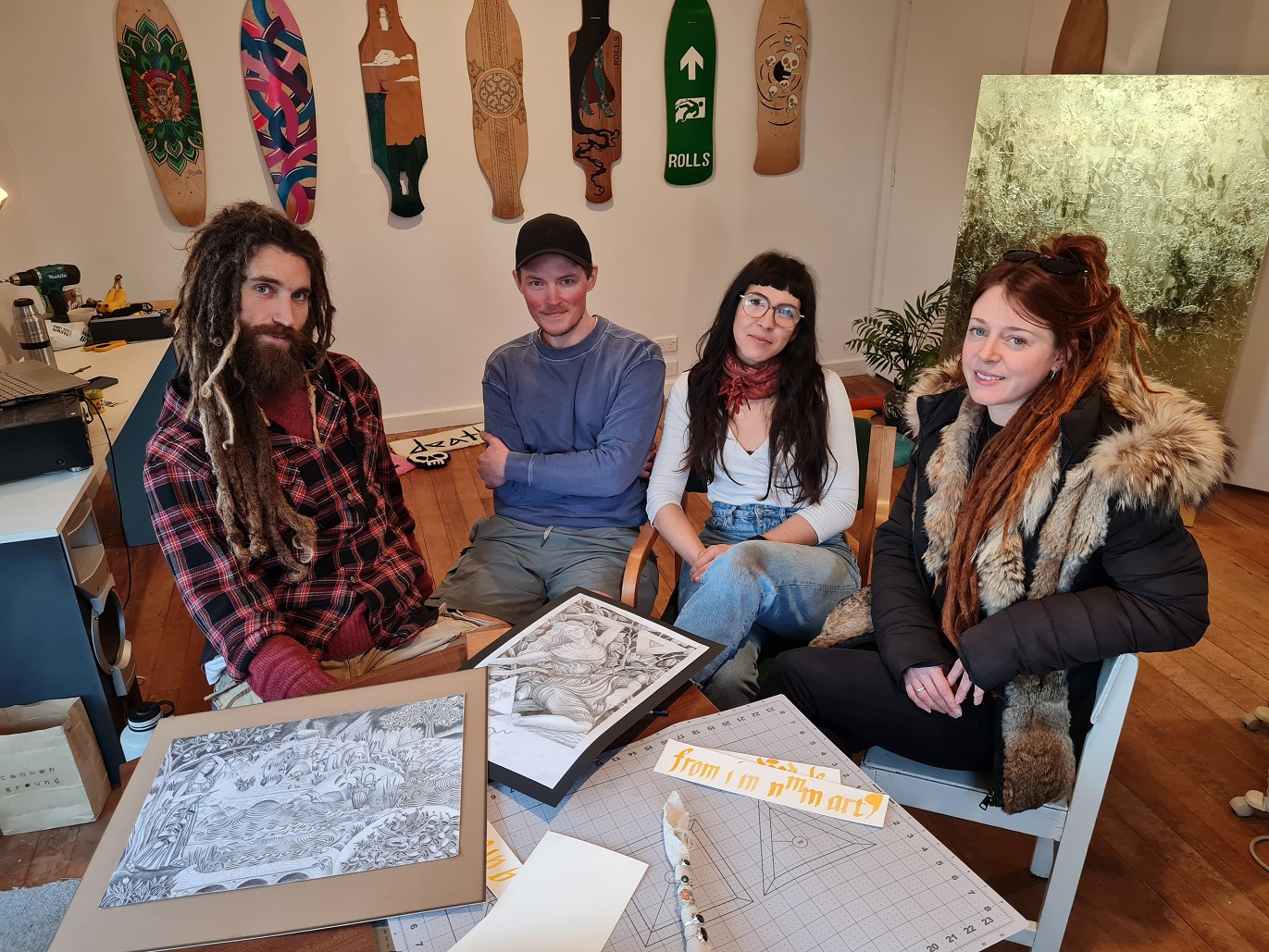 Surrounded by some of their art are (from left) Cameron Anderson, Morgan Nyvelius, Magdelena...