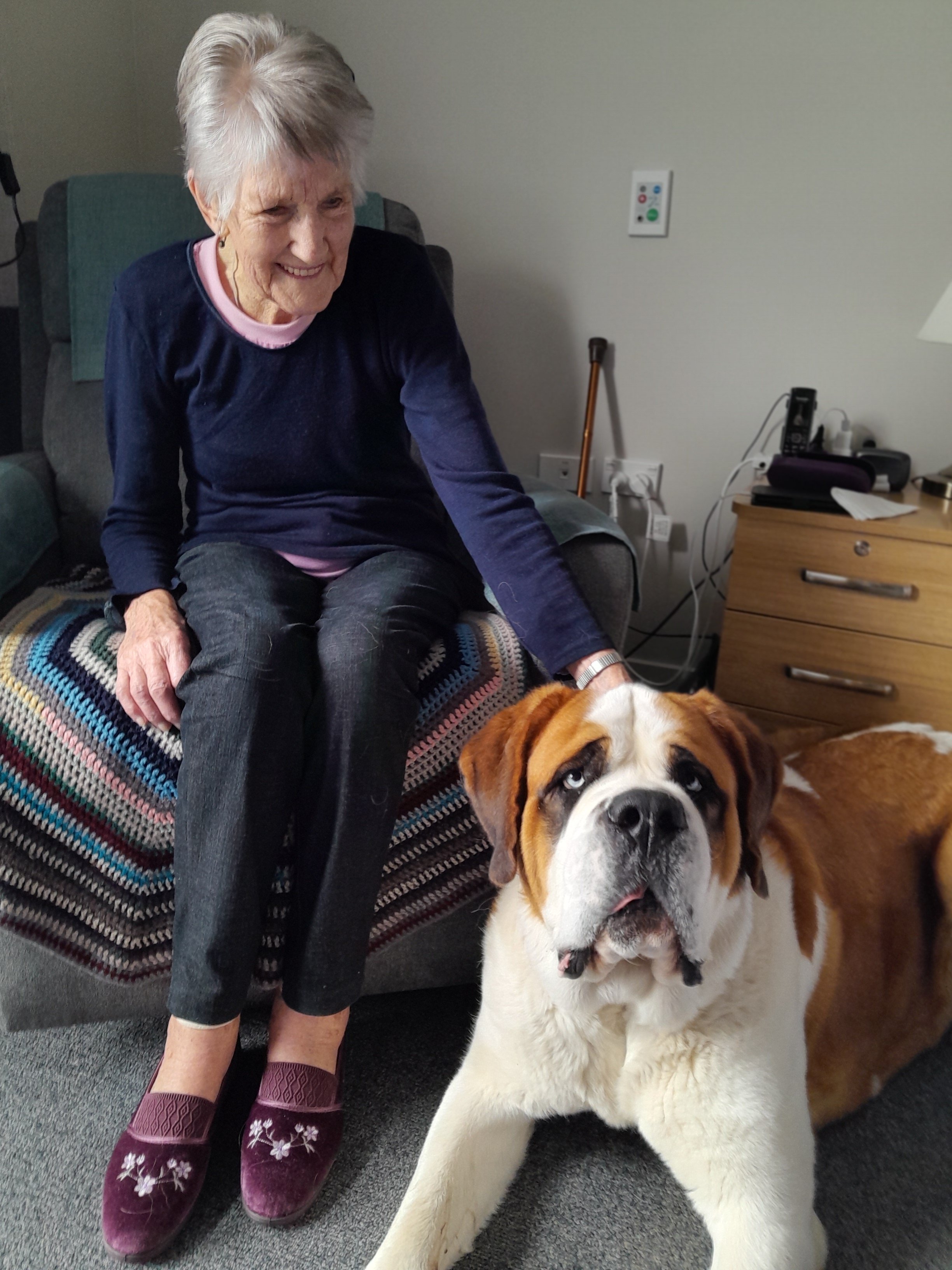 Oamaru Observatory Village resident Ella Lamb enjoys some time with visiting St Bernard, Luca....