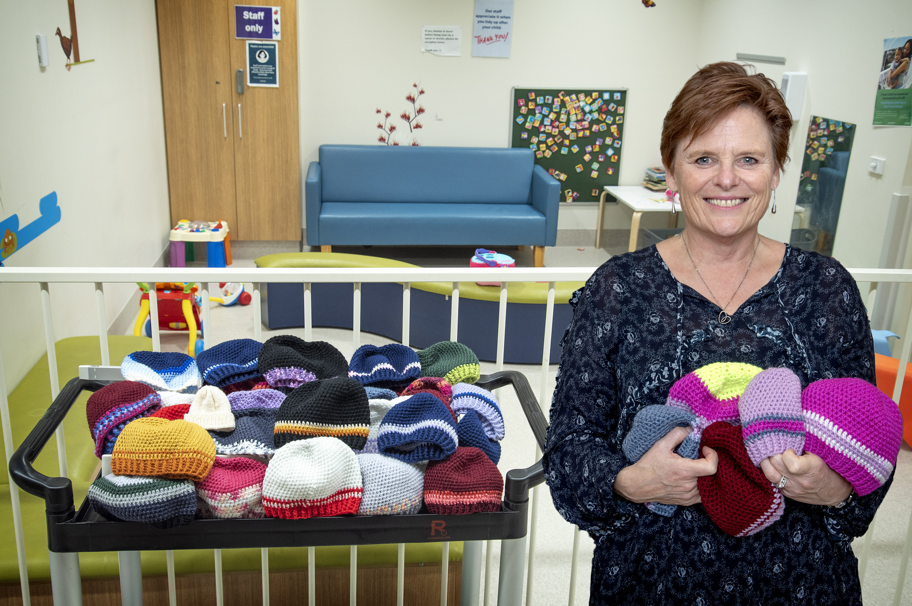 Stephanie Schwabe with the crocheted hats she makes for babies and toddlers in Christchurch...