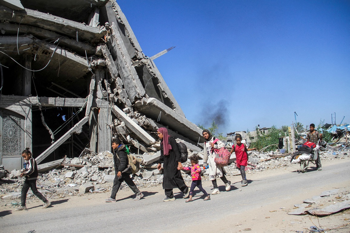 Displaced Palestinians ordered by the Israeli military to evacuate the northern part of Gaza flee...