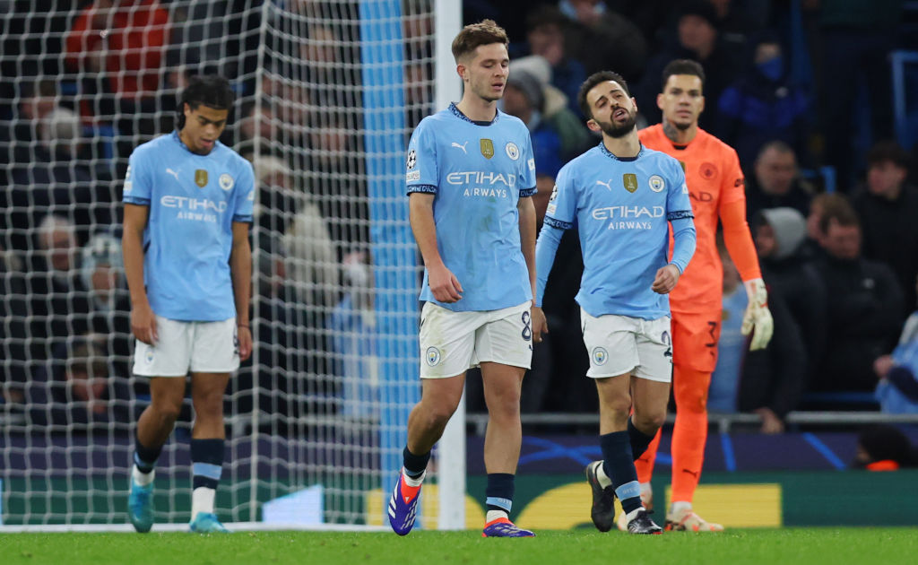Manchester City players react after conceding their third and equalising goal this morning. Photo...