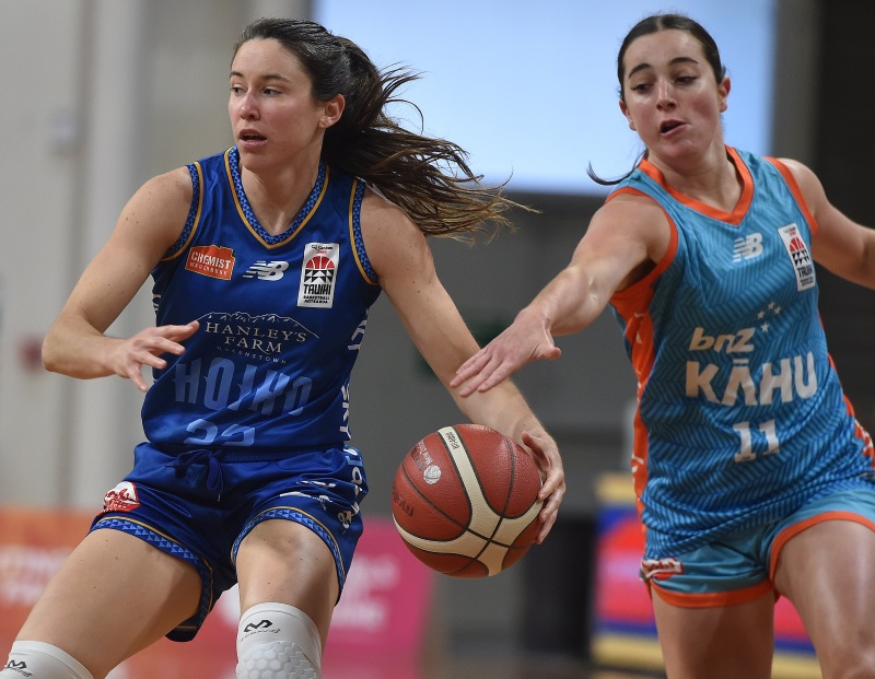 Southern Hoiho guard Paige Bradley brings the ball down the court under pressure from Northern...
