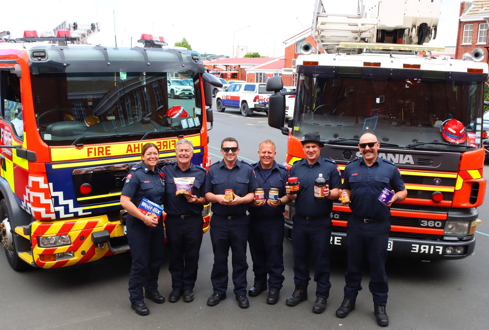 Gearing up to collect for a good cause are firefighters (from left) Aimee Taylor, Mark Leonard,...