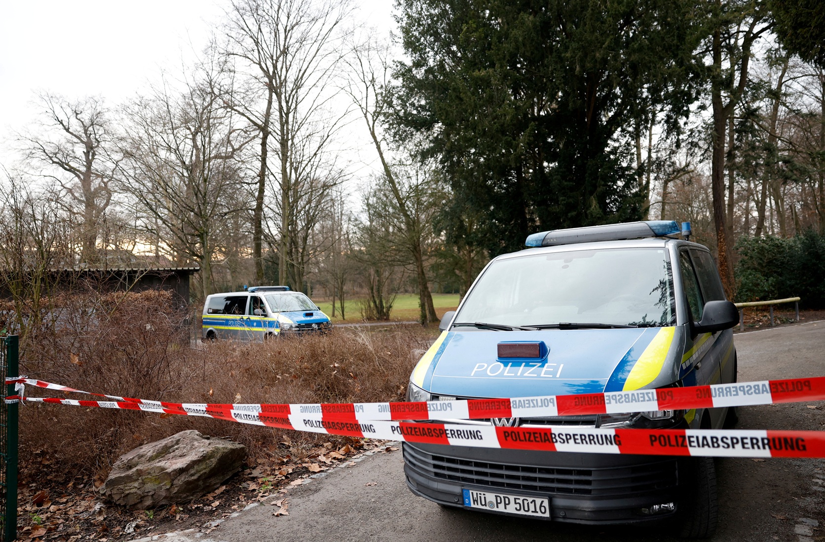 German police secure the park in Aschaffenburg where two people were killed in a knife attack....