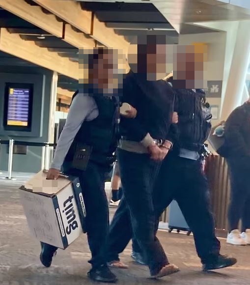 The female prisoner was on board an Air New Zealand flight from Auckland to Wellington, flanked...