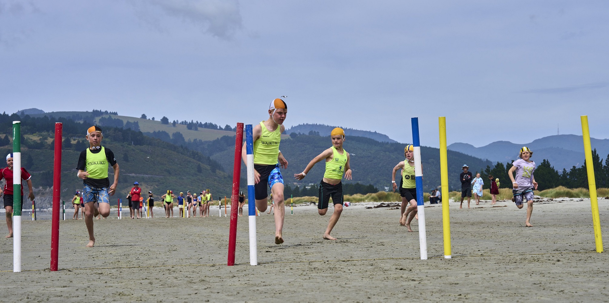 Junior surf lifesavers compete in beach flags on Saturday.