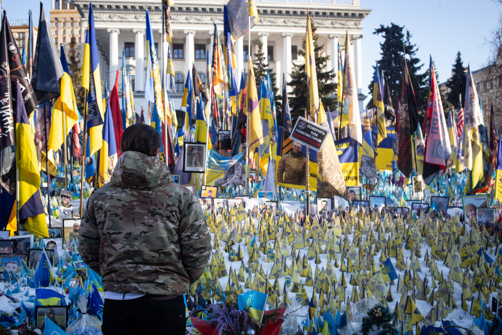 Relatives Went To Clean The Portraits Of Fallen Soldiers In The Ukrainian War, in Kyiv, Ukraine....