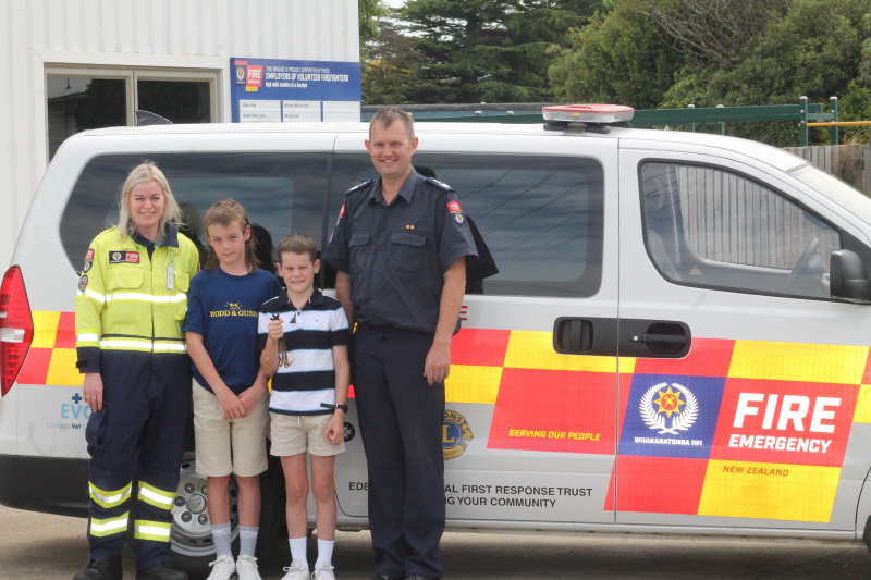 Standing between medical first repsonder Taryn Latta and Chief Fire Officer Brent Shepard are...