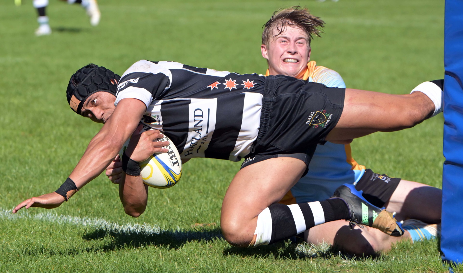 Southern’s Paul Tupa’i slips past University wing Finlay Hagen to score during their premier club...