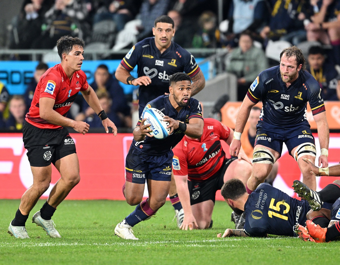 Highlanders halfback Folau Fakatava makes a break during the Super Rugby game at Forsyth Barr...