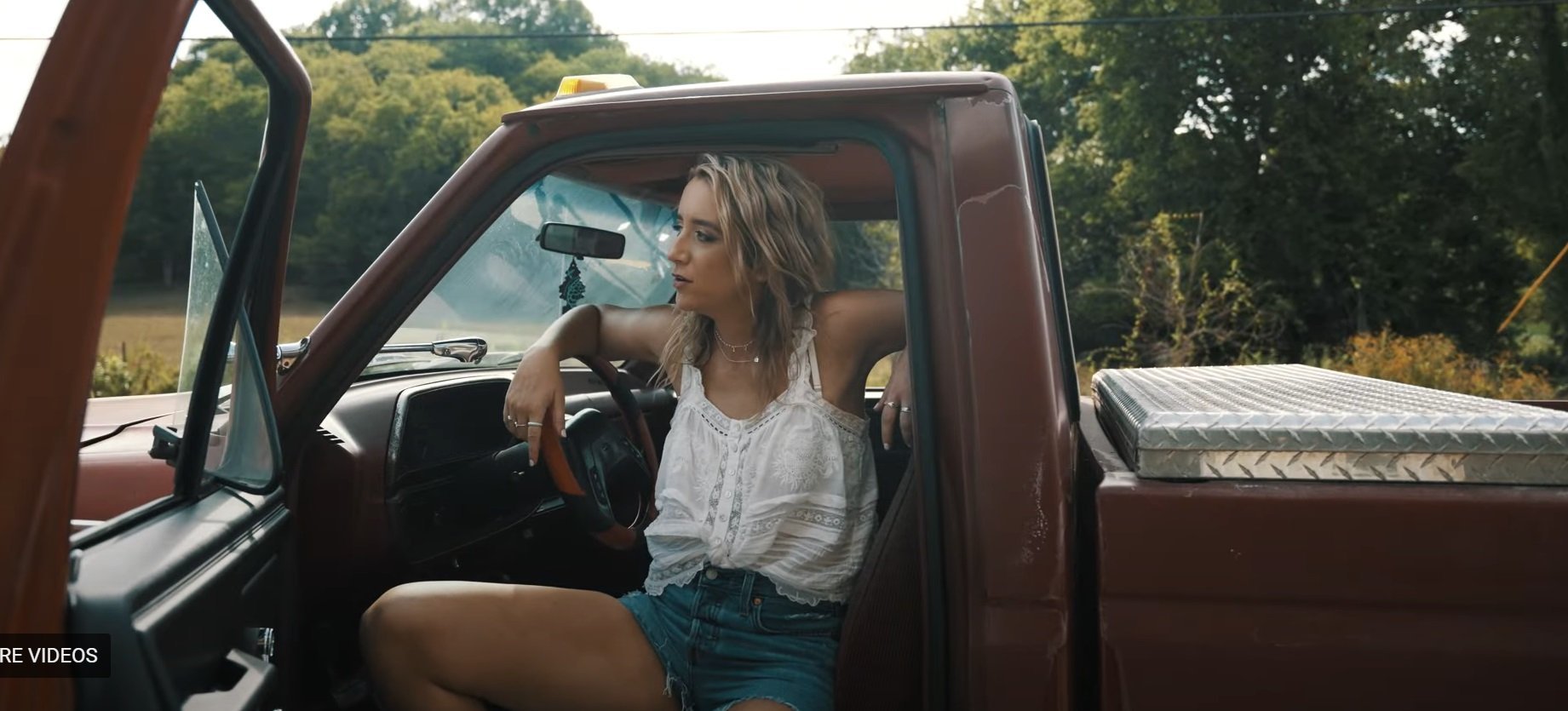 Kaylee Bell sings in the video for single Small Town Friday Nights.