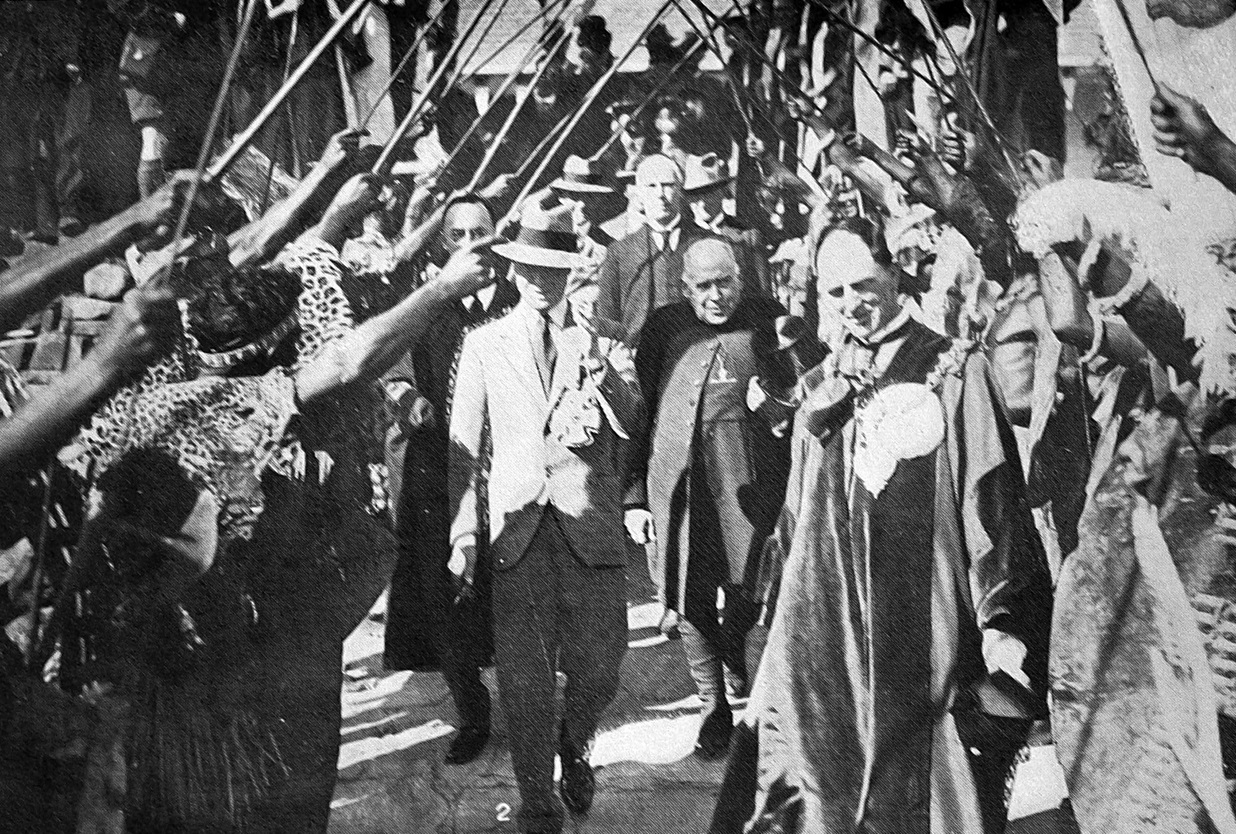 Edward, Prince of Wales is seen passing between the ranks under an arch of assegais at Rhodes...