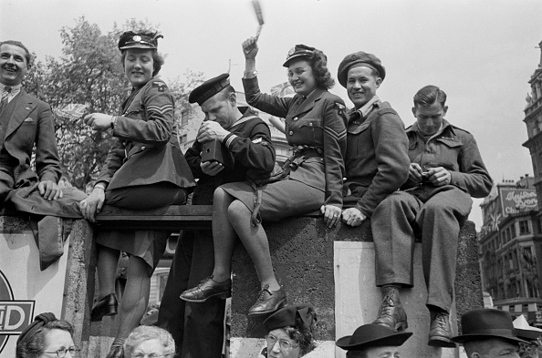 A celebration like no other ... Members of the British Armed Forces among the crowds celebrating...