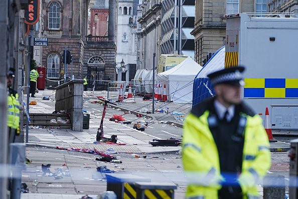 Police tents surrounded by debris at the scene in Water Street near the Liver Building in...