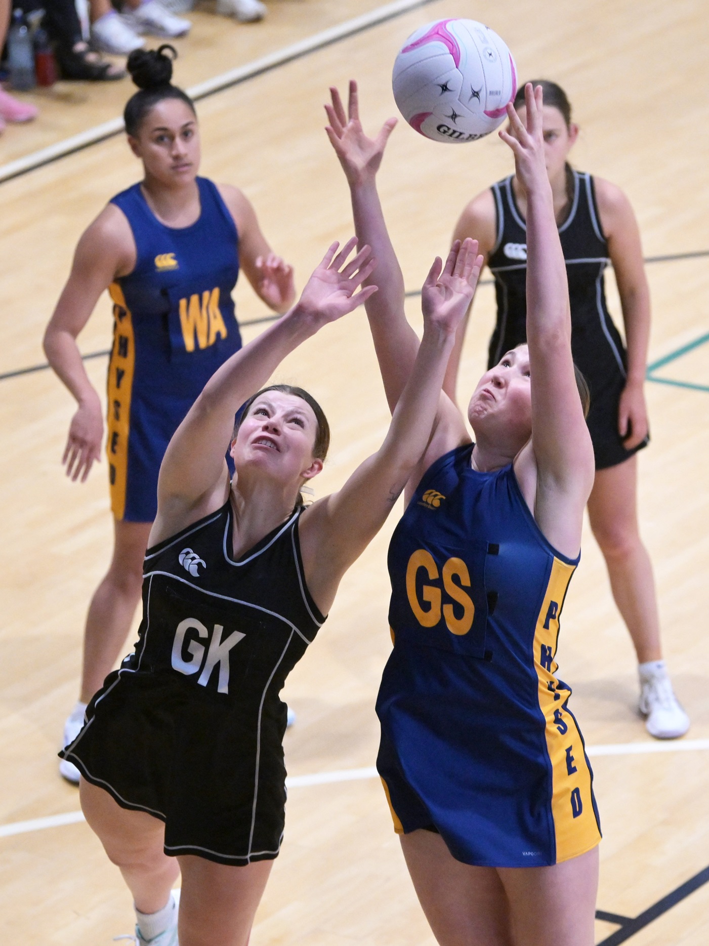 Physed A goal shoot Lucy Morrison battles for the ball with Southern Magpies goal keep Rebecca...
