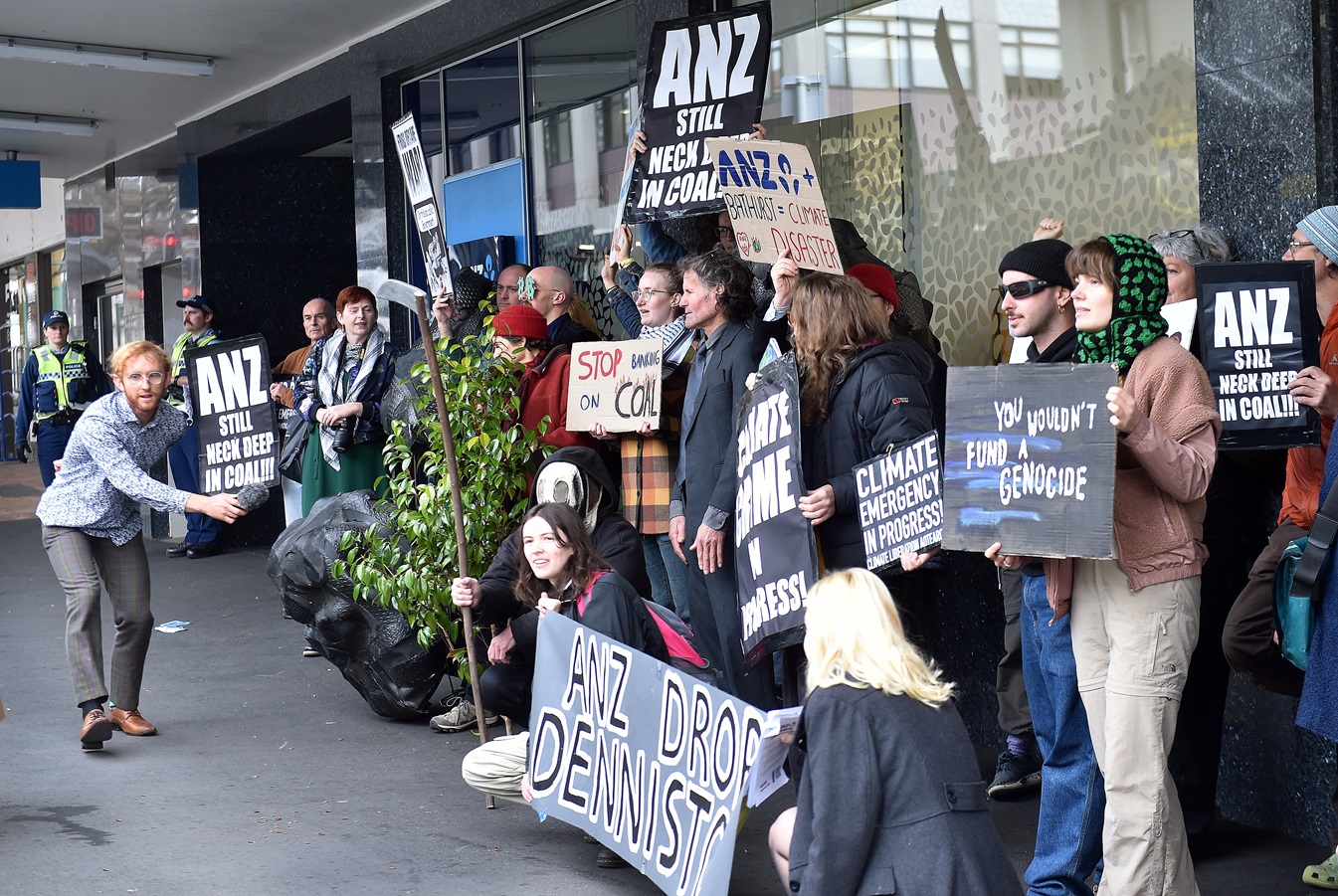 Mr Currie (far left) during Wednesday’s protest outside ANZ’s Dunedin central branch. Photo:...