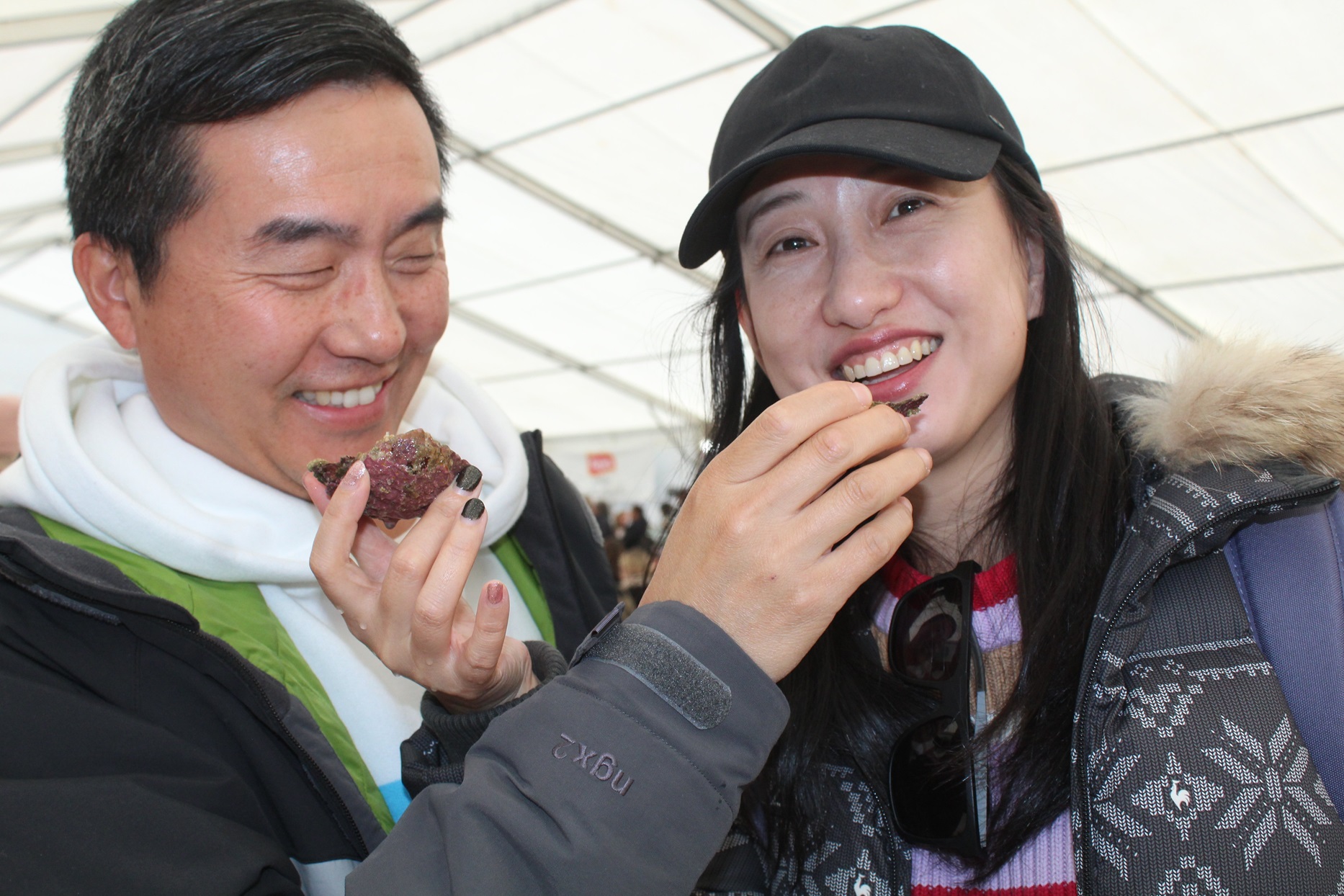 Tasting Bluff oysters are Ley Chen (left) and Yuwhan Xu at the Bluff Oyster and Food Festival on...