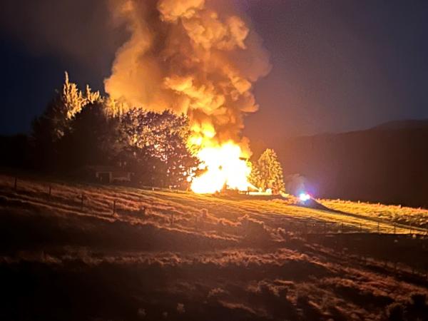 The house on fire in Waikaia in February last year. Photos: NZ Police
