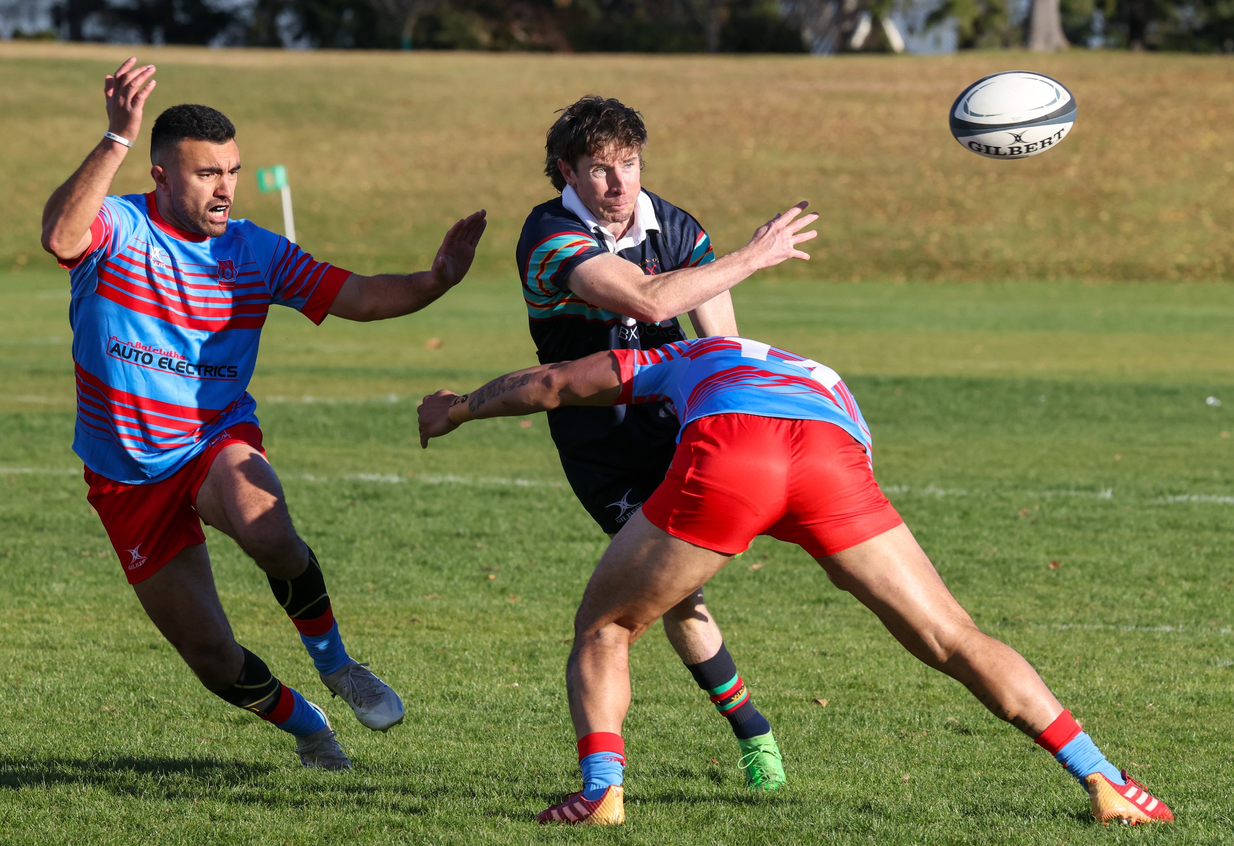 Central’s Conor Hamlin offloads in the tackle of Southern’s Ratu Karamaena. PHOTO: RICHARD JONES