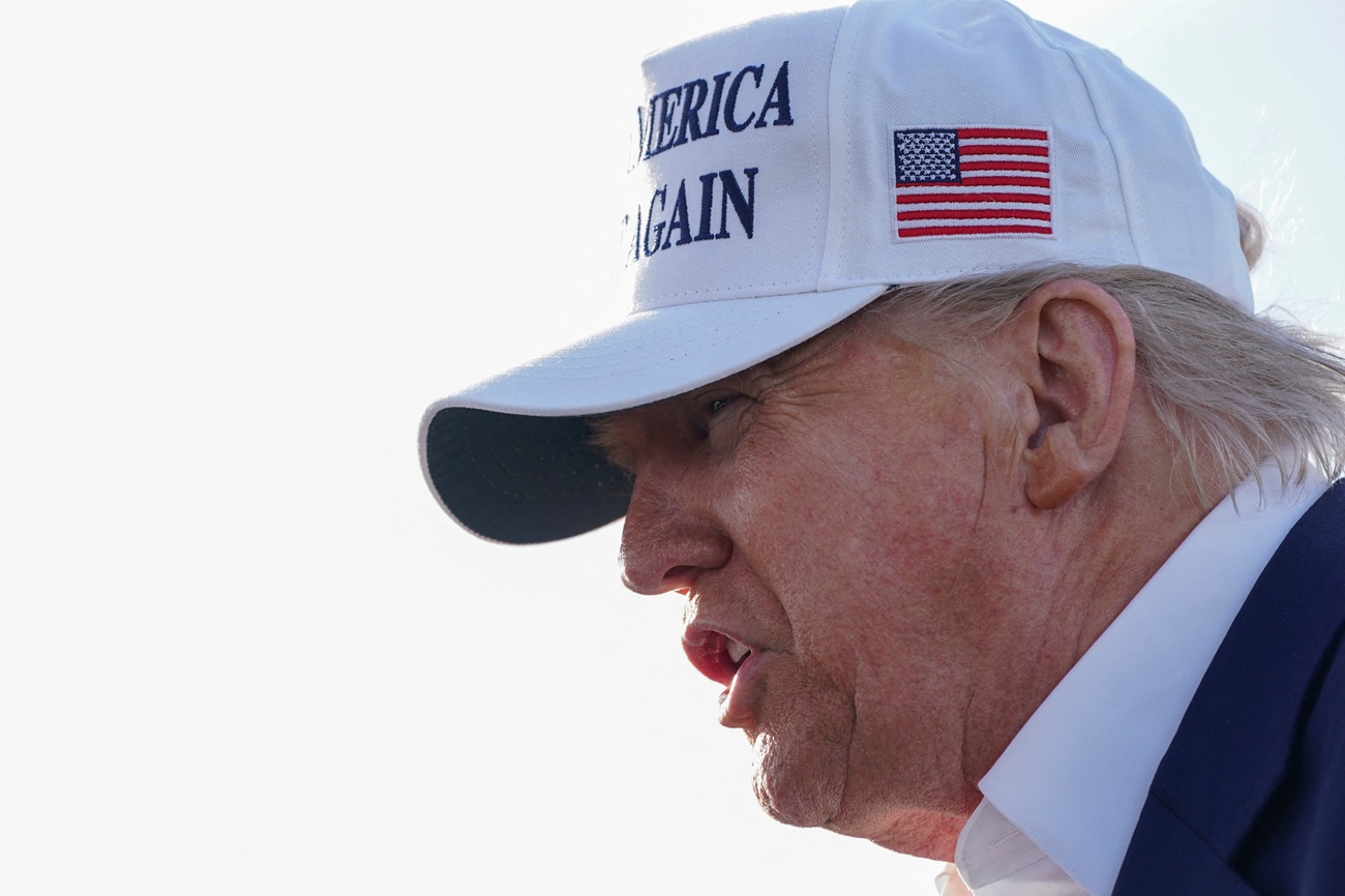 US President Donald Trump speaks to the media before boarding Air Force One in Morristown, New...