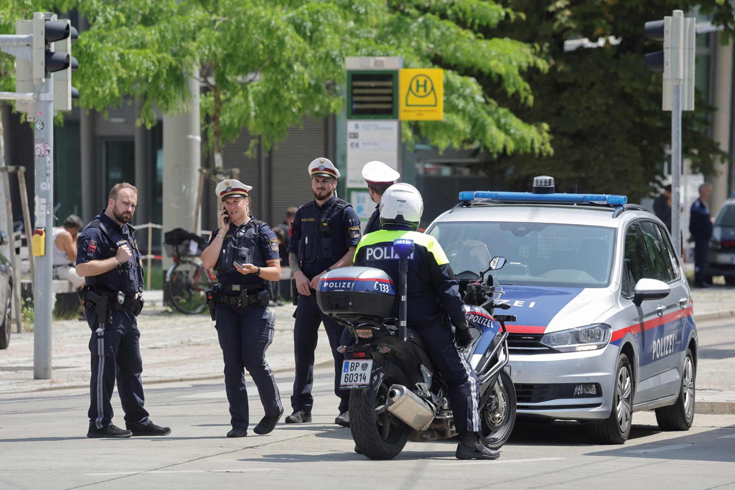 Police officers stand guard near the school following the shooting in Graz, Austria. Photo: Reuters