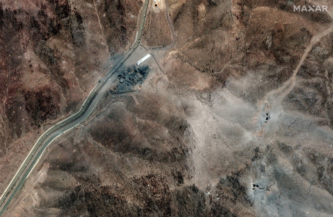 A satellite image shows airstrike craters on the perimeter of the Fordow Fuel Enrichment Facility...