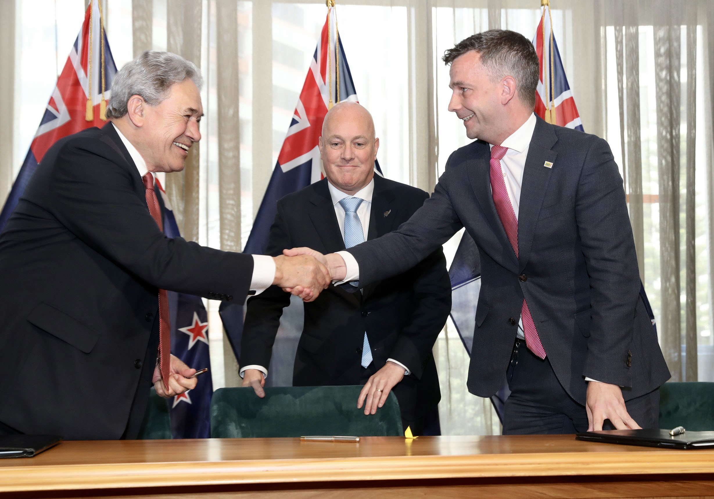 Act New Zealand leader David Seymour (right) and New Zealand First leader Winston Peters shake...