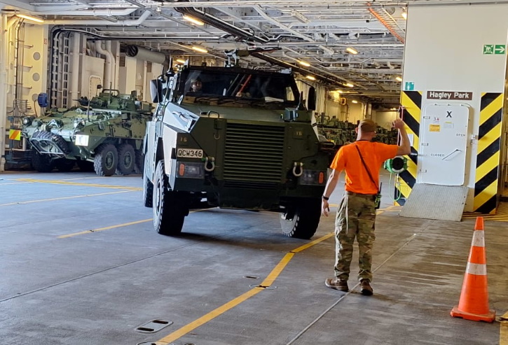 A new NZ Defence Force Bushmaster armoured vehicle being driven on to the HMNZS Canterbury in...
