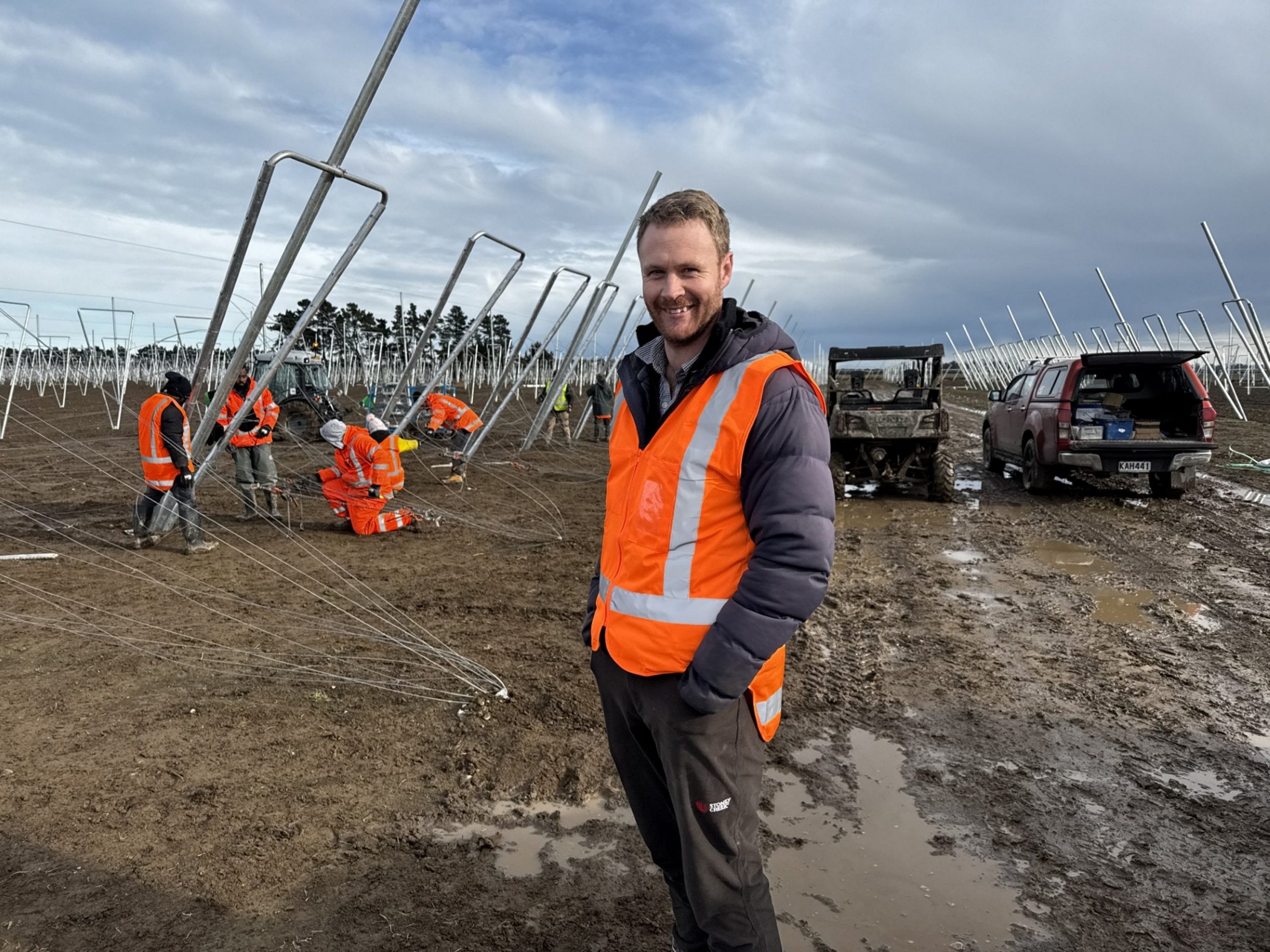 Orchard manager Matt Bentley of Ashburton oversees trellis installation prior to planting next...
