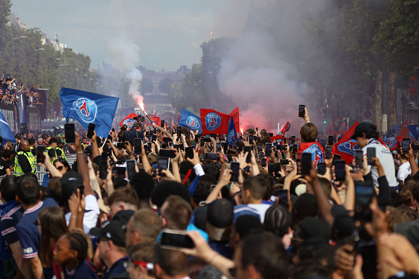 Football fans celebrate Paris Saint-Germain's UEFA Champions League title in Paris. Photo: Getty...