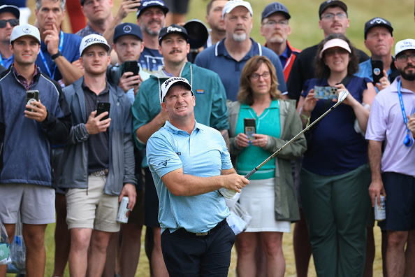 Ryan Fox closes his eyes and hopes after his second shot on the 18th hole at Oakmont. Photo:...
