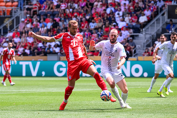 Bayern Munich striker Harry Kane controls the ball against Auckland City defender Michael Den...