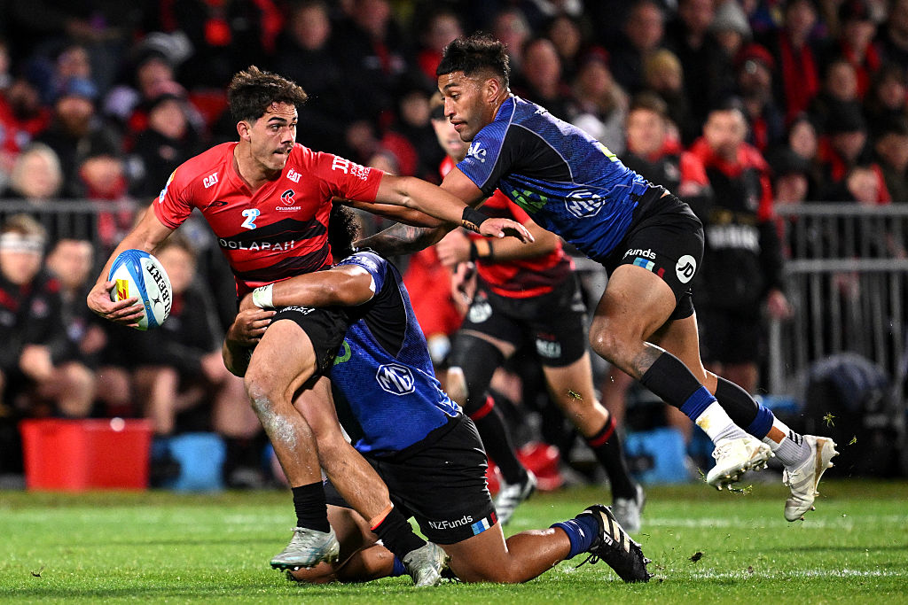 The Crusaders' Noah Hotham fends off Rieko Ioane of the Blues during the match. Photo: Getty