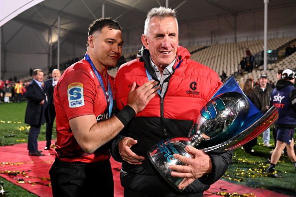 David Havili of the Crusaders and head coach Rob Penney celebrate after winning the Super Rugby...