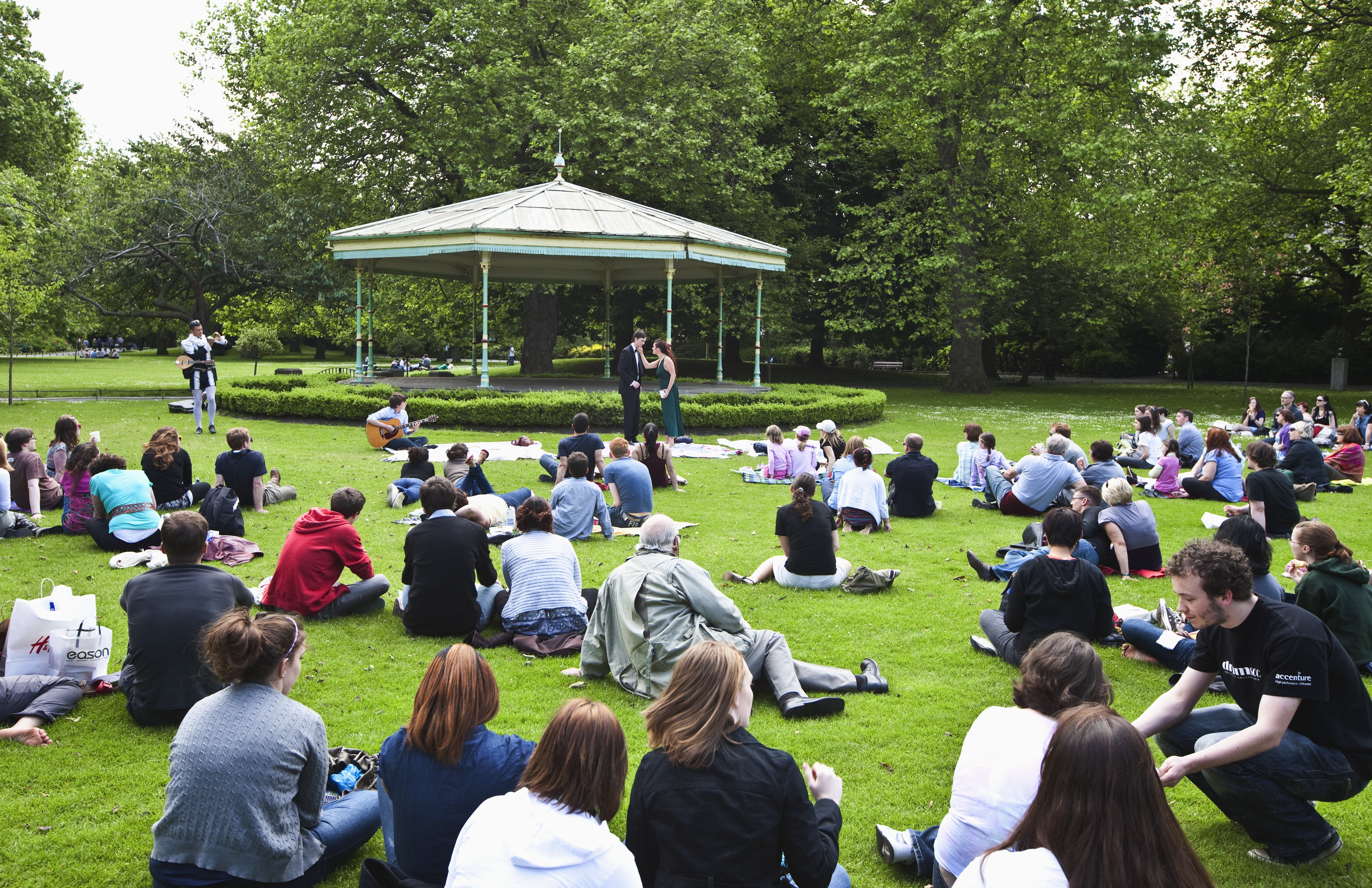 People watch a performance at St Stephen’s Green, Dublin. PHOTOS: GETTY IMAGES