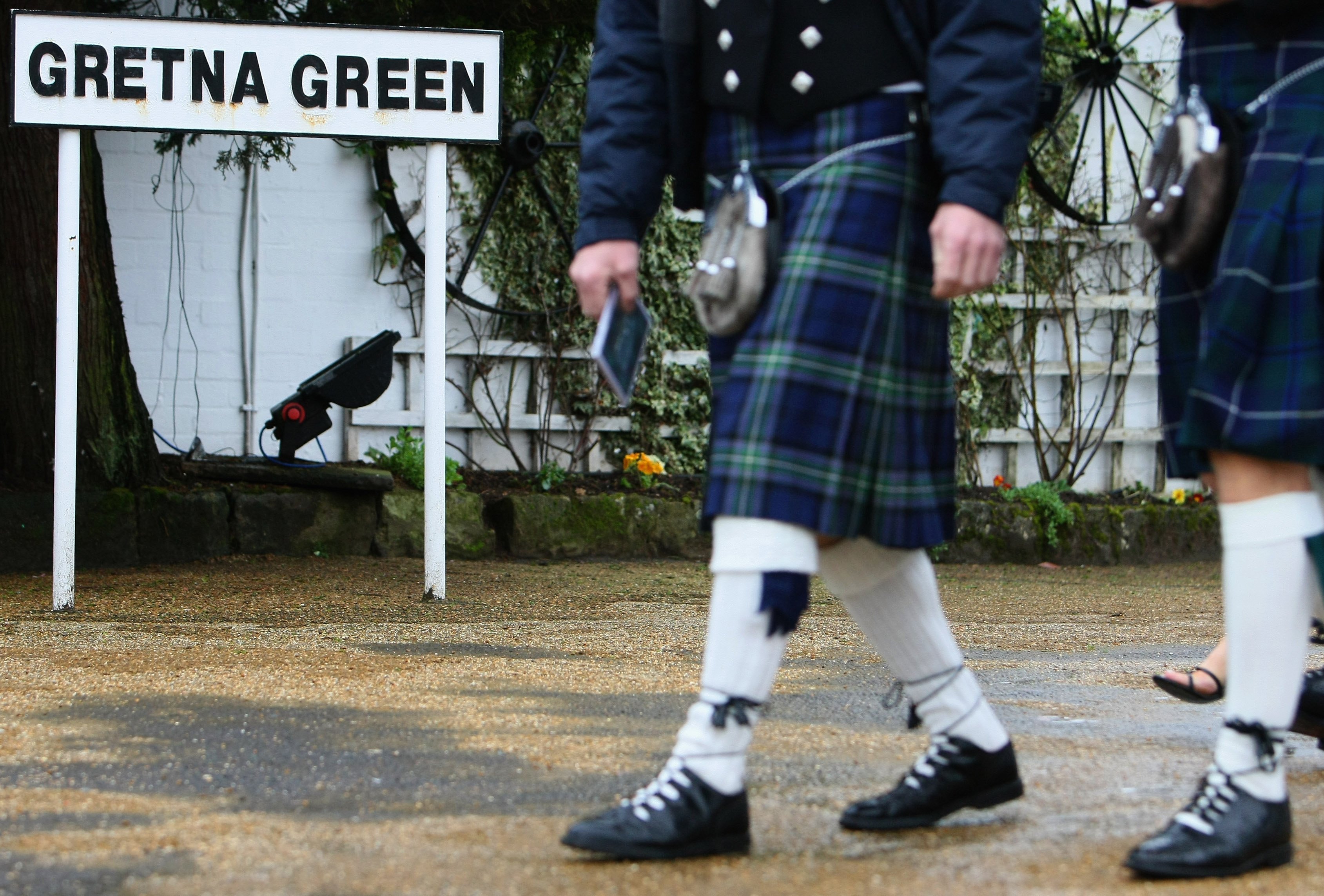 A wedding party walk to their venue at Gretna Green. PHOTO: GETTY IMAGES
