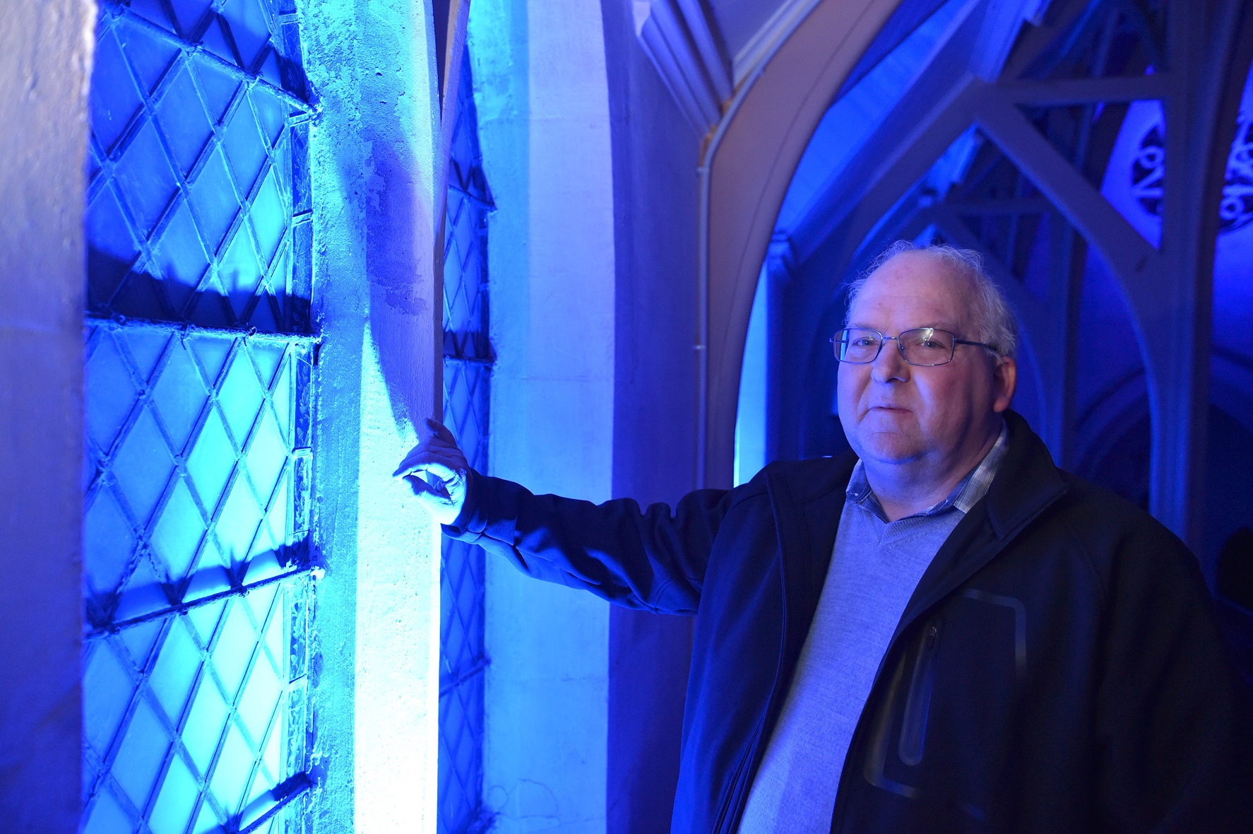 Project leader Bruce Clark tests the effect of the blue lights.