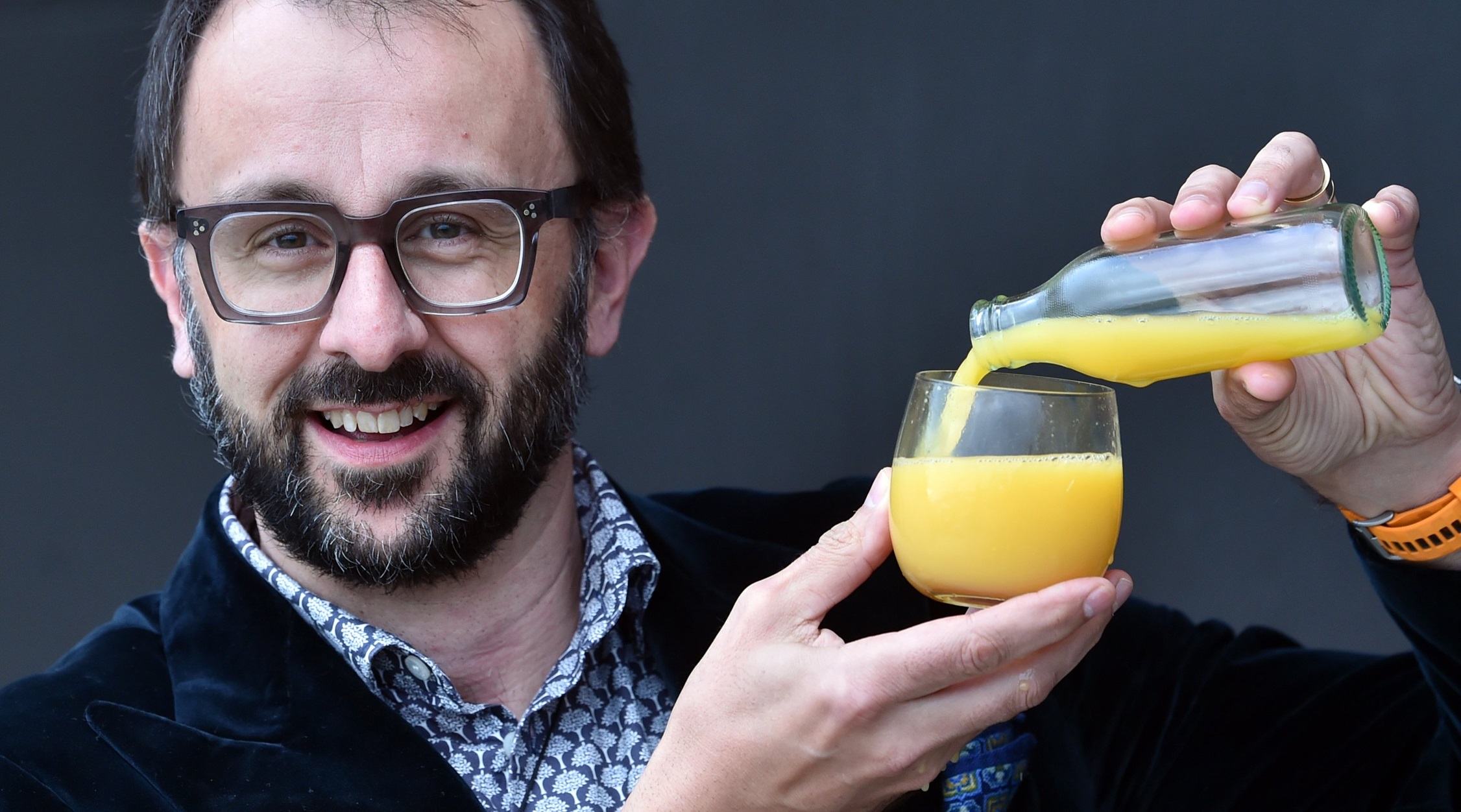Dunedin oncologist Prof Chris Jackson pours a glass of orange juice, referencing a vitamin C ...