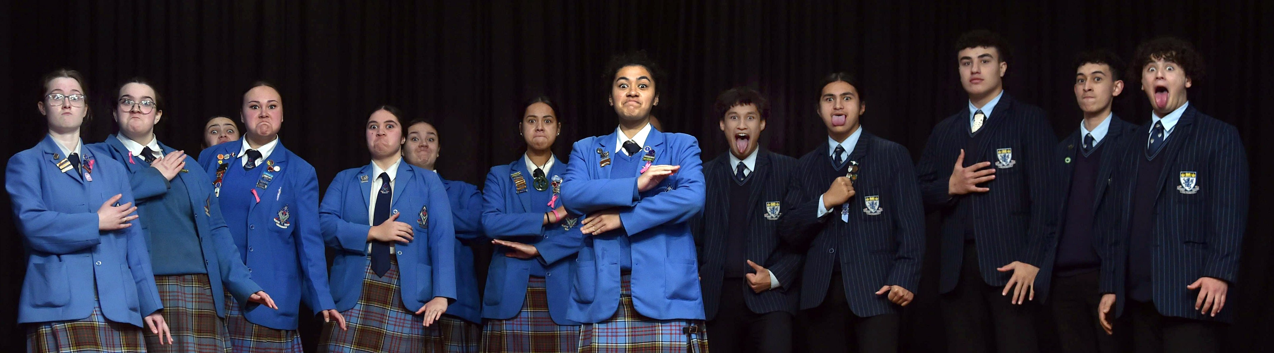 Queen’s High School Māori prefect Jade Taani stands centre stage in front of He Waka Kōtuia as...