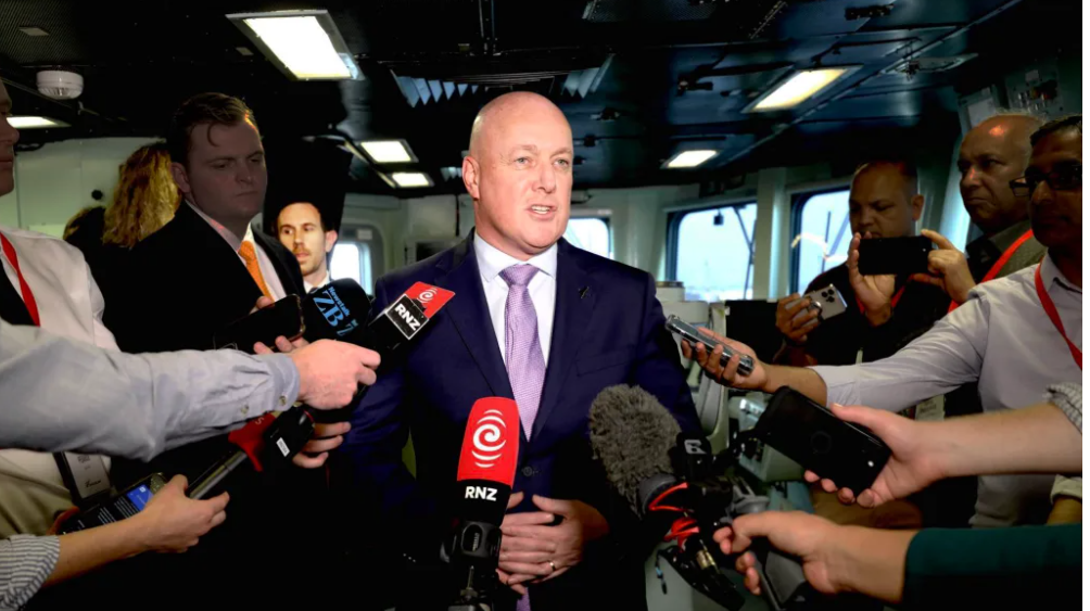 Prime Minister Christopher Luxon talking to media. His deputy chief press secretary Michael...