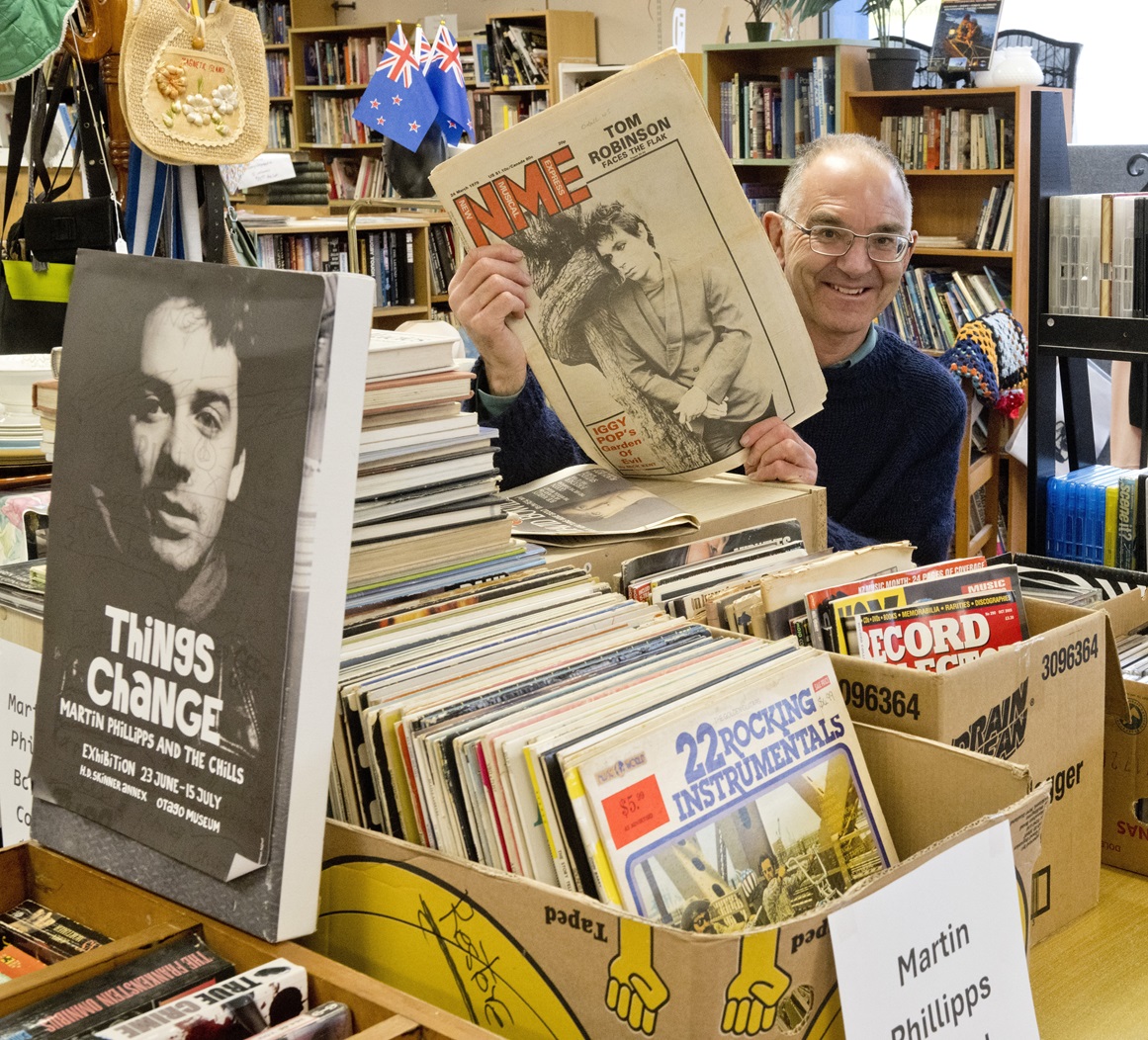 Dunedin ReStore worker Grant McDougall displays treasures from the Martin Phillipps collection...